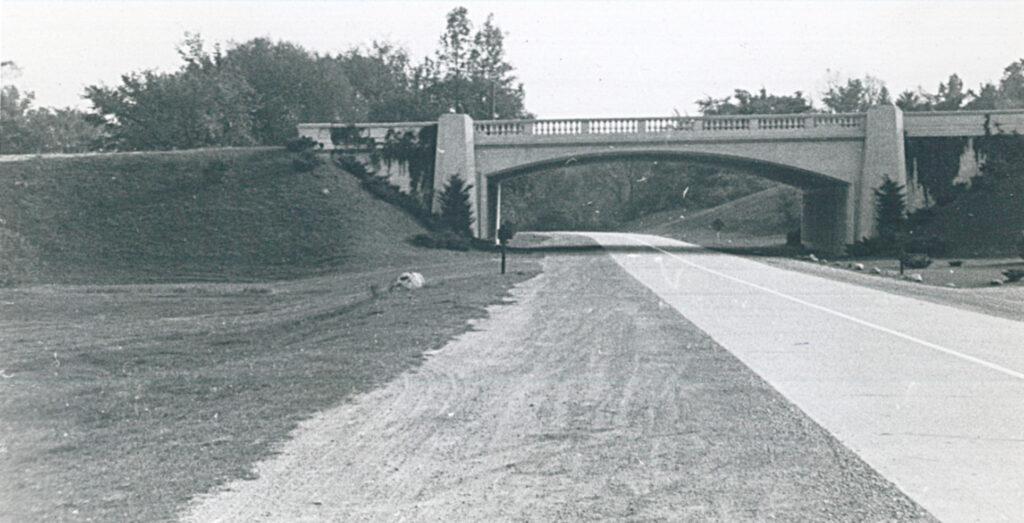 Black and white photo of a bridge over Hines Drive in 1938